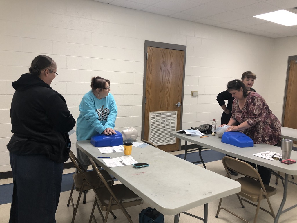 Faculty doing chest compressions